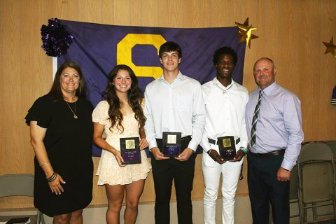 Most Outstanding Athlete Award winners are Riley Rainosek (second from left), Ryan Peterson (middle) and Dalton Brooks (second from right) along with Desiree Nitsch (left) and Daniel Boedeker (right). Photo by Mark Lube.