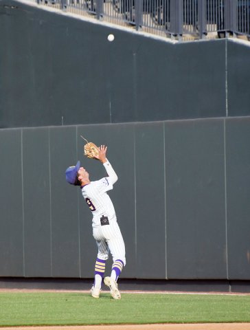 Sophomore second baseman Carson Schuette focues on a fly ball in first-base foul territory in the state semifinal game against New Home on June. 7. Photo by Mark Lube.