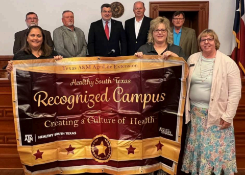 The Moulton Elementary School recently received the designation as a Healthy South Texas Recognized Campus. The campus was commended at Monday’s Commissioners’ Court meeting. The honor was awarded by the Texas AgriLife Extension Service. Holding the banner presented to the school are from left Moulton Elementary third grade teachers, Tiffany Janak and Anita Drabek along with County Extension agent, Natalie Knesek. Back row from left are commissioners Dennis W. Kocian and Kenny Siegel, County Judge, Keith Mu