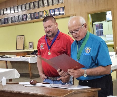 District Deputy Reggie Guettner, right, past Grand Knight of Shiner’s Council 3081 in Shiner and current council trustee presents current Grand Knight Mark Yackel a proclamation from the National Council recognizing the local council’s many achievements in its first 75 years.