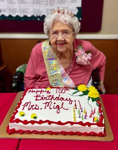 Millie Migl is shown with her birthday cake.