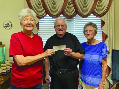 Wied KJZT Society #53 recently held a church fundraiser to offset the maintence costs of four cemeteries - St. Mary’s, St. Ludmila of Wied, St. Augustin of Worthing and St. Anthony of Witting. Pictured, left to right, are Helen Janak, Msgr. John Peters and Anita Grabarkievtz.