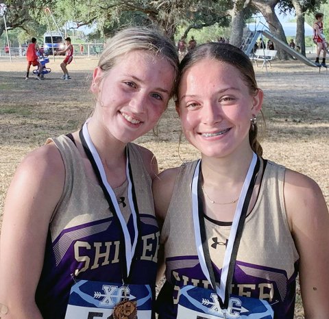 Hayleigh Burns (left) and Emma Joslin finished in fourth and No. 17, respectively, in the varsity girls 1A-2A race at the Moulton meet Saturday. Photo courtesy of Michelle Winkenwerder. 