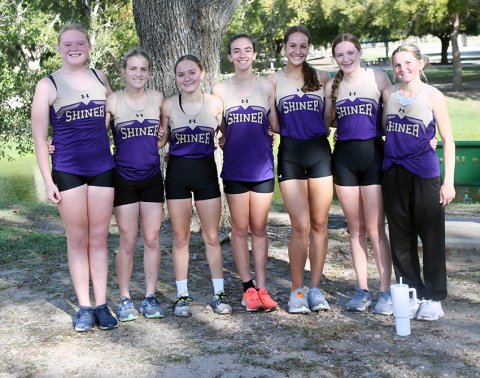 Shiner Lady Comanches XC District champions . From left are Eve Roberts, Hayleigh Burns, Emma Joslin, Megan Burns, Erin Pustka, Callie Chrismon and Jo Caka. Photo by Mark Lube.