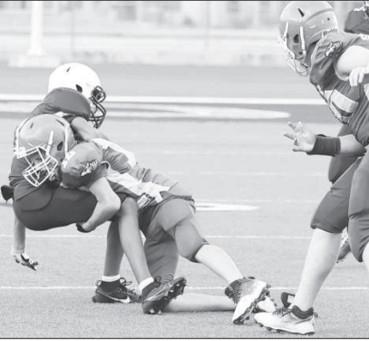 A SJS player makes a tackle during the football game against the Trinity Episcopal Patriots. Photo courtesy of Raymond Rosas.