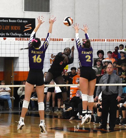 Morgan Lenehan (16) and Callie Sevcik (2) jump to try to block a Schulenburg kill attempt Oct. 24 in Schulenburg Photo by Mark Lube.