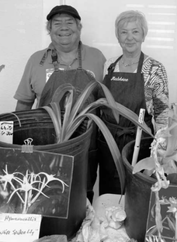Guest speaker for the “Heirloom Bulbs” program, Robert Martinez, Brazos County Master Gardener, and his aide Madeleine Kissinger.  Photo by Sharon Harrigan