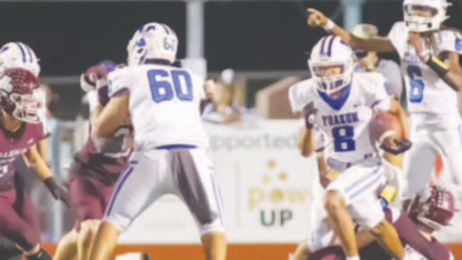 Qyion Williams (8) runs with through a lane while Zach Taylor (6) and Oliver Ortiz (60) assist. Photo courtesy of Raymond Rosas.