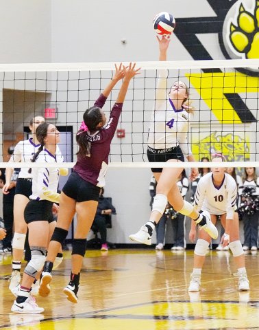 Aimee Mitchon taps the ball over the net in the Lady Comanche’s bi-district match with Kenedy Monday night in Yorktown. The senior had 11 kills in Shiner’s 3-0 win. Photo courtesy of Howard Esse.