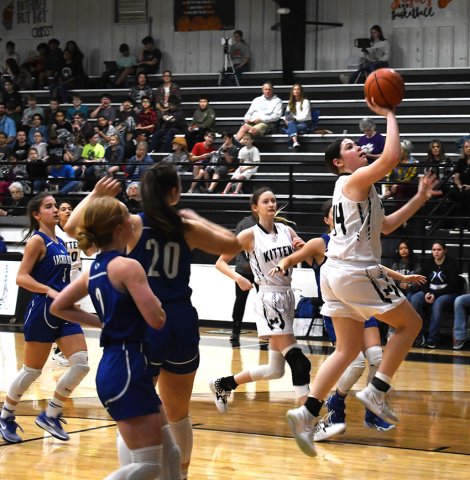 Audrey Swinford puts up a shot in the first half of the Kitten’s tournament game against Sacred Heart on Dec. 8. She finished with nine points in Moulton’s 30-25 win. Photo by Mark Lube.