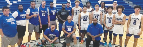 Yoakum High School boys basketball alumni, varsity players, and coaches. The alumni game was won by the varsity team in overtime on Tuesday, Dec. 19 in Yoakum. Contributed photo.