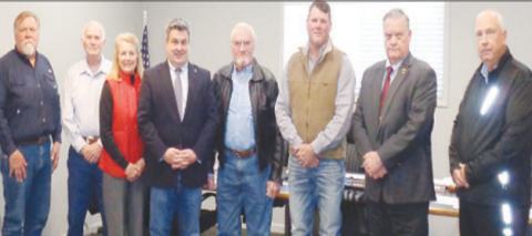 Pictured (at left) from left to right are Board of Director members, Walt Hairell, Lonny Montgomery, Deborah Sevcik, Judge Keith Mudd, Ronald Braeuer, Roddy Renger, James Fenner, and Fred Hilscher. Contributed photo. 