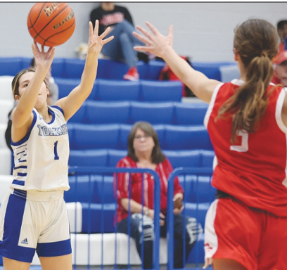 Madison Gonzales takes a shot at the basketball game on Jan. 23 against the Lady Cardinals. Photo courtesy of Raymond Rosas.