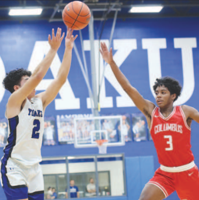 Isaac Martinez shoots the ball in Yoakum against Columbus on Jan. 23. Photo courtesy of Raymond Rosas.