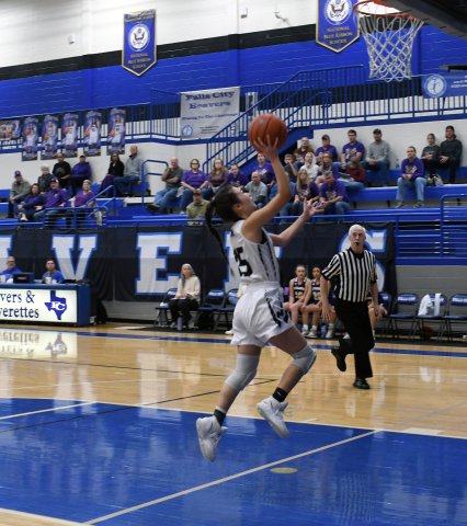 Estefani Colchado attempts a jump shot in the first half. Photo by Mark Lube.