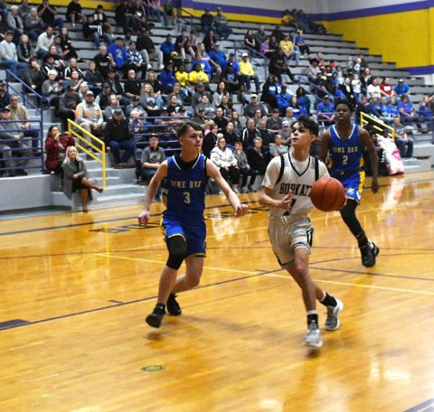 Seth Beyer eyes the basket as he drives into the lane. Photo by Mark Lube.