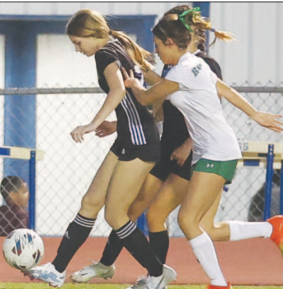 Emmie Leftwich sets up to kick the soccer ball for a score. Photo courtesy of Raymond Rosas.