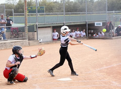 Karsyn Blahuta takes a swing at a pitch against St. Paul. She had one of Moulton’s two hits in the game. Photo by Mark Lube.