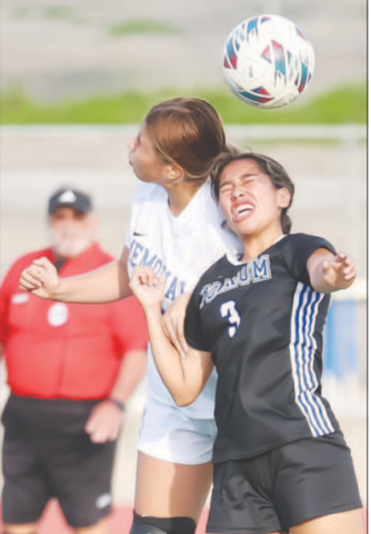 Rubi Martinez (3) gets the ball against a player. Photo courtesy of Raymond Rosas.
