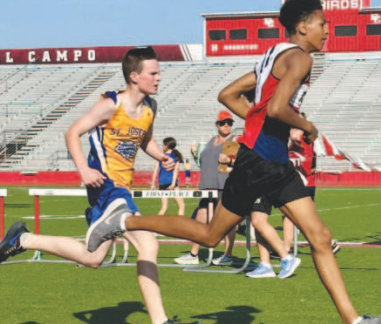SJS Tiger Dominic Novak (In yellow) finished second in a close race in the 800-meter run in El Campo at the St. Philip’s Track Meet with a time of 2:23:81. Trinity EpiscopalVictoria placed first at the finish line. Contributed photo.