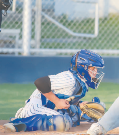 YHS Bulldog catcher Ty Gordon stops the ball against the Brahmas in Hallettsville. Photo courtesy of Raymond Rosas.