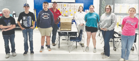 Pictured from left to right are Coltyn New, Wyatt James, Gunnar Frank, Beekeepers Robert Fojtik and Stephanie Fojtik, Jana Justiss, Addyson James, and Emerson Flessner. Contributed photo.