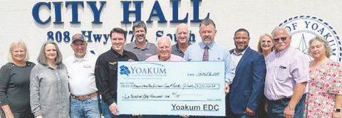 YEDC reimbursed a $250,000 grant for improvements at Circle Y. From left to right are YEDC Secretary Linda Schmidt, YEDC Executive Director Genora Young, Tucker Saddles Vice President Darrell Nephew, Circle Y President Garrett Bottlinger, Kaspar Companies Board Member Michael Trojcak, YEDC Board Member Doug Kaspar, City of Yoakum Mayor Carl O’ Neill, YEDC President Layne Brandt, Kapsar Companies COO Peter Robinson, YEDC Board Member Pam Ward, Circle Y Distribution Manager Mark Jemelka