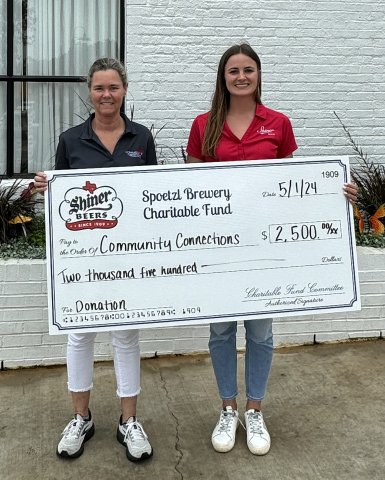 Pictured are Becky Janak, Community Connection Program Manager, left, and Lauren Petras, Spoetzl Charitable Fund member.