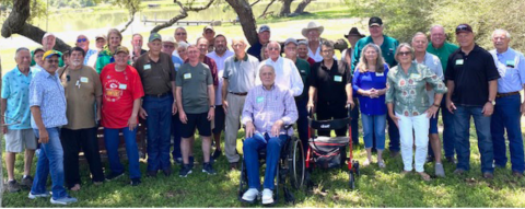 Pictured are members of his teams with Bill. He is the fourth person from the left on the front row. Photo by Darrell Appelt