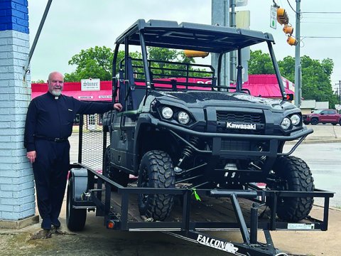 Father Bryan Heyer is pictured with a 2024 Kawasaki Mule Pro FXT, which will be given away at this weekend’s picnic. Included is a 12 ft. utility trailer with ramp gate, generously donated by Boehm Tractor Sales. If you would like to purchase a ticket, please call the church office or visit the church’s website, www.sscmshiner.org.