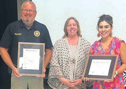 Moulton ISD receives a proclamation designating the school as a Healthy South Texas Campus. Pictured from left to right is school board President Daniel Beyer, County Extension Agent Natalie Knesek, and Elementary School Principal Victoria Ortiz. Photo by Clayton Kelley