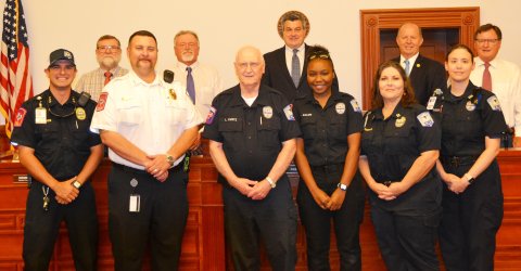 Lavaca County EMT, Lawrence Kurtz was recognized at Monday’s Commissioners’ Court meeting for 47 years of emergency service for the citizens of Lavaca County. In the proclamation approved by the court, it said Kurtz has responded to thousands of emergency calls throughout his career as a emergency technician. Front row, left to right, are Lavaca County EMS members Tim Decker (assistant chief), Michael Furrh (chief), Kurtz, Aiyannia  Adams, Melissa Leopold and Fiona Thomas; back row, left to right, are commi