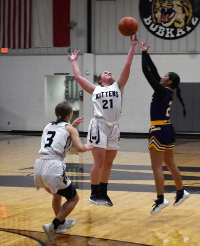 Madison Rothbauer (21) attempts to deflect a Runge pass Karsyn Blahuta (3) also in on the play. Photo by Mark Lube.