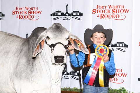Kaston Tipp is shown with his heifer, Miss TR Candy 977.