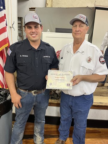 Ryan Panus (5 years), left, and Daniel Muehlstein, president of the SVFD. 