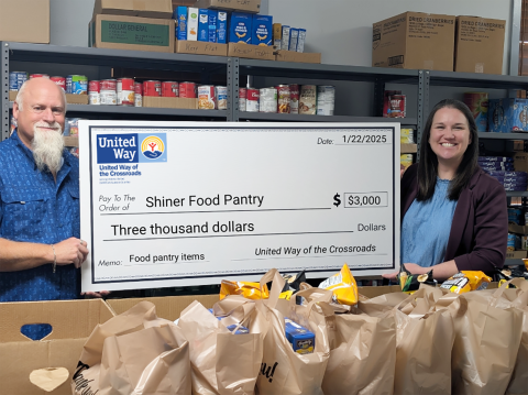 Pictured is Shiner Methodist Church Pastor and Shiner Food Pantry director, Darin Zumwalt and United Way of the Crossroads Executive Director, Bethany Castro.