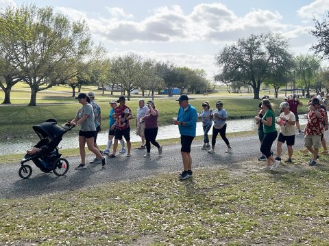 Participants enjoy refreshments while walking in Green-Dickson Park. Staff photo.