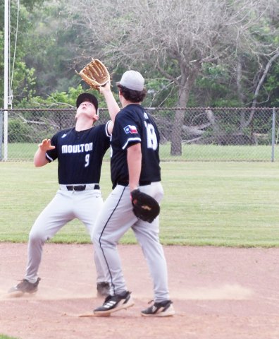 Travis Haikenwaelder gets underneath a fly ball during Moulton’s game against Weimar. Jaxon Bartos provides cover on the play. Photo by Mark Lube