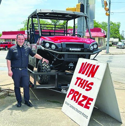 Father Jacob Mendoza is pictured with a 2025 Kawasaki Mule Pro FXT 1000LE, which will be given away at this weekend’s picnic. Included is a Falcon 14 ft. single axle trailer, generously donated by Boehm Tractor Sales. If you would like to purchase a ticket, please call the church office or visit the church’s website, www.sscmshiner.org.