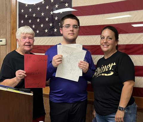 Pictured are, left to right, Shiner VFW auxiliary member JoAnn Muehlstein, John Moore and Meagan Moore. 