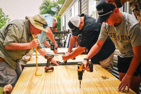 Shown above are members of the Shiner Rotary Club working to build a new handicap wheelchair ramp for a Shiner resident.
