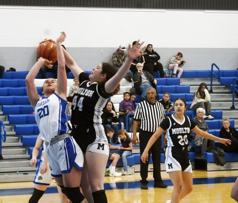 Audrey Swinford defends Lilly Fojt inside the circle during the first half. Photo by Mark Lube.