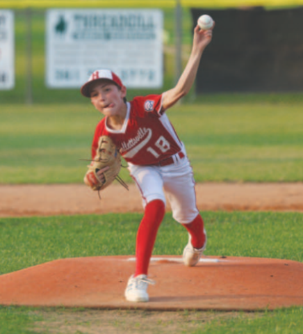 Photo by Chuck Grafe Holt Thigpen delivers a pitch during the game here Sunday evening..