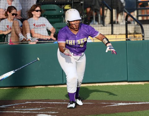 Patricia Price races off to first base after putting the ball into play. She got two hits and scored twice. Photo by Chuck Grafe/Hallettsville Tribune-Herald.