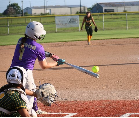 Avery Colman makes contact against Rockport-Fulton June 30. She was one of four players with three hits. Photo by Mark Lube. 