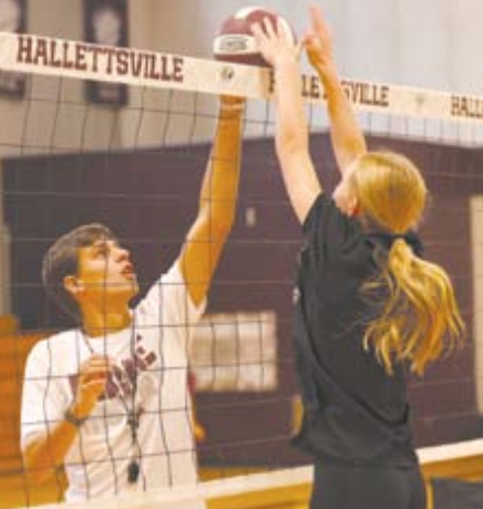 Photo by Chuck Grafe Coach Rylan Schindler works with Heidi Grahmann at Monday afternoon’s practice.