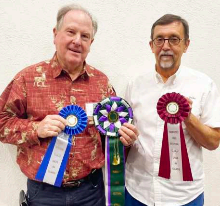 Local artists, Roy and Blanche Cavaretta and Michael Moore placed at the 55th annual Ruidoso Art Festival that took placetwo weeks ago in in Ruidoso, New Mexico. The Cavarettas won best of show, while Roy also won first place in mixed media for one of his gourd entries. Michael Moore brought home a second place finish for a fused glass entry. From left are Roy Cavaretta and Michael Moore. Blanche Cavaretta is absent from the photo. Photo provided by Michael Moore