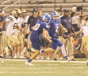 Photo by Chuck Grafe Dillon Goedrich carries the ball in the third period.