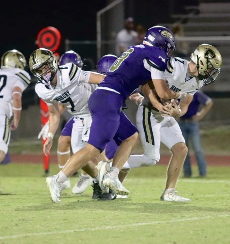 Carson Brown makes the initial contact on a Danbury ball carrier Friday night in the 16-2ADI opener for the Comanches. The Comanches offense tore up Danbury’s defense and the Shiner defense kept the Panthers out of the end zone in a 60-0 win. Photo by Louann Heinsohn.