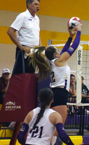 Harlee Sevcik (12) makes an attack at the net with Savannah Durrett (21)  backing her up in Shiner’s sweep of Hallettsville on Aug. 25.  Photo by Mark Lube.